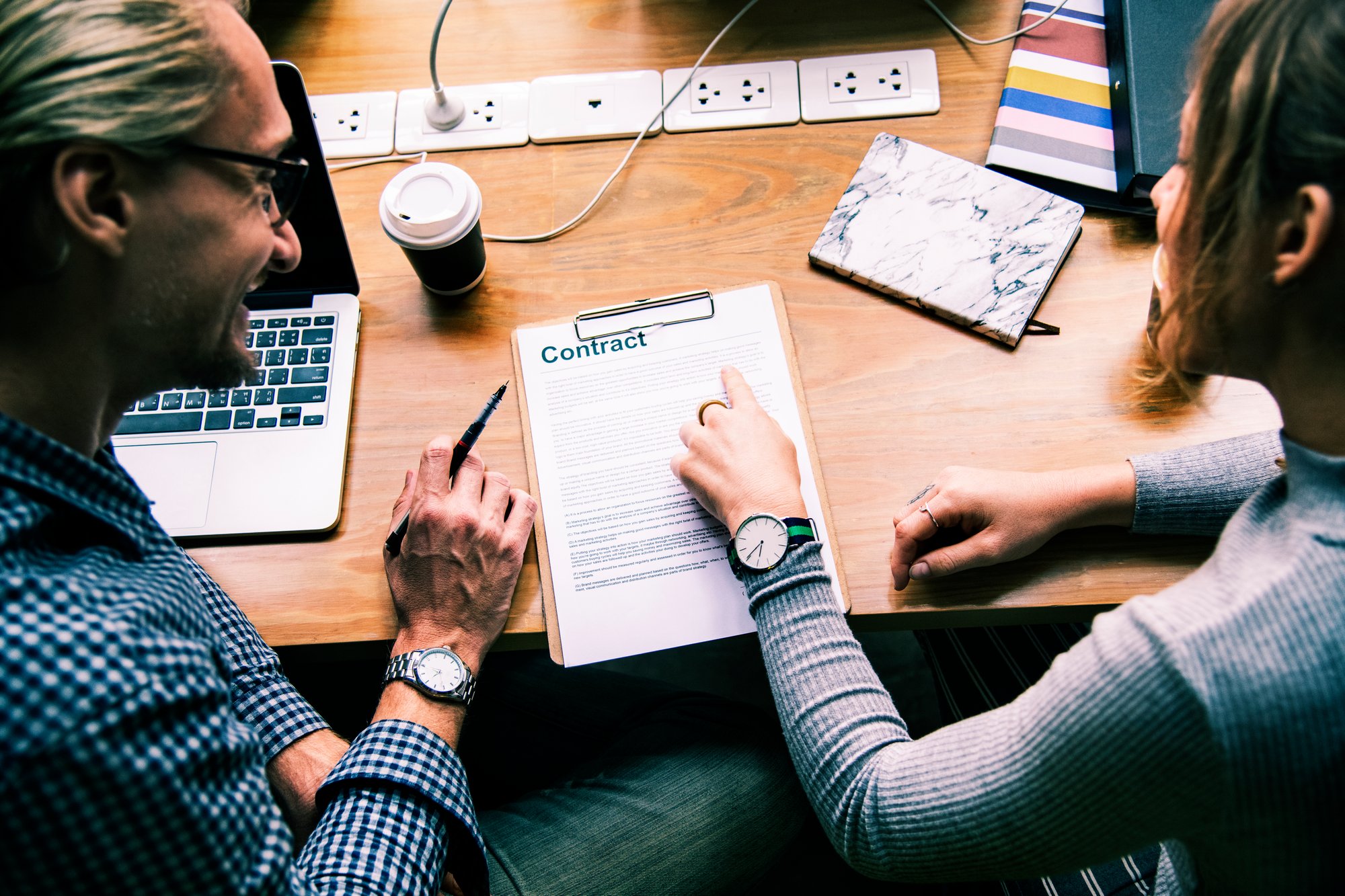 business-people-discussing-contract