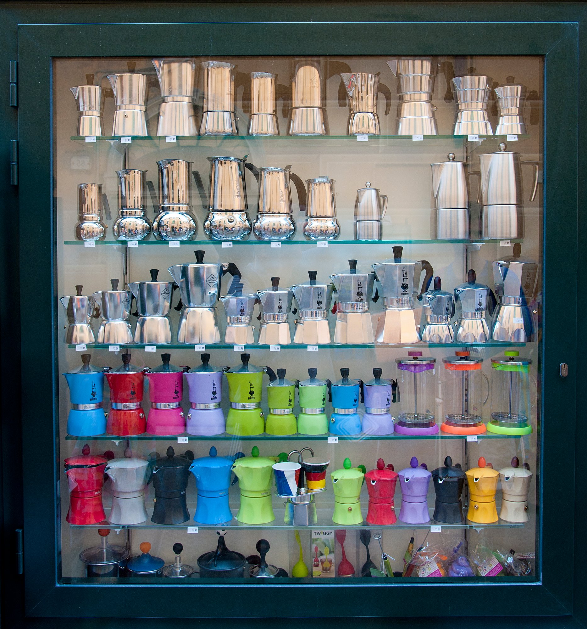colorful-coffee-makers-arranged-shelf-store colorful-coffee-makers-arranged-shelf-store