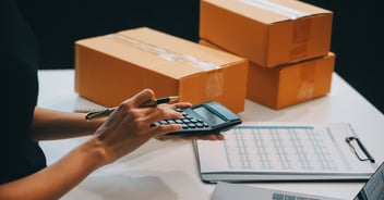 Person calculating invoices