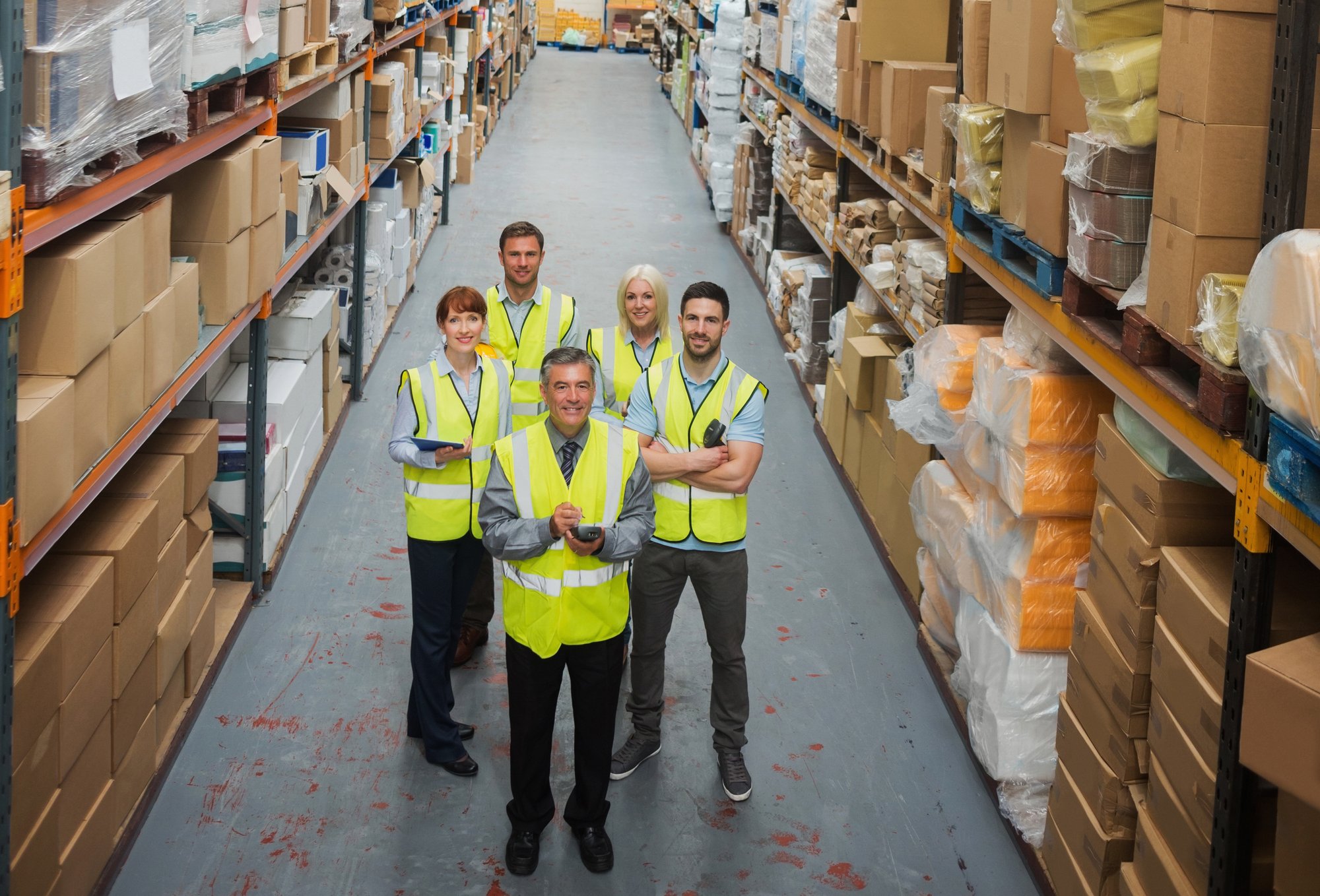 warehouse-team-smiling-camera crop 3 warehouse-team-smiling-camera crop 3