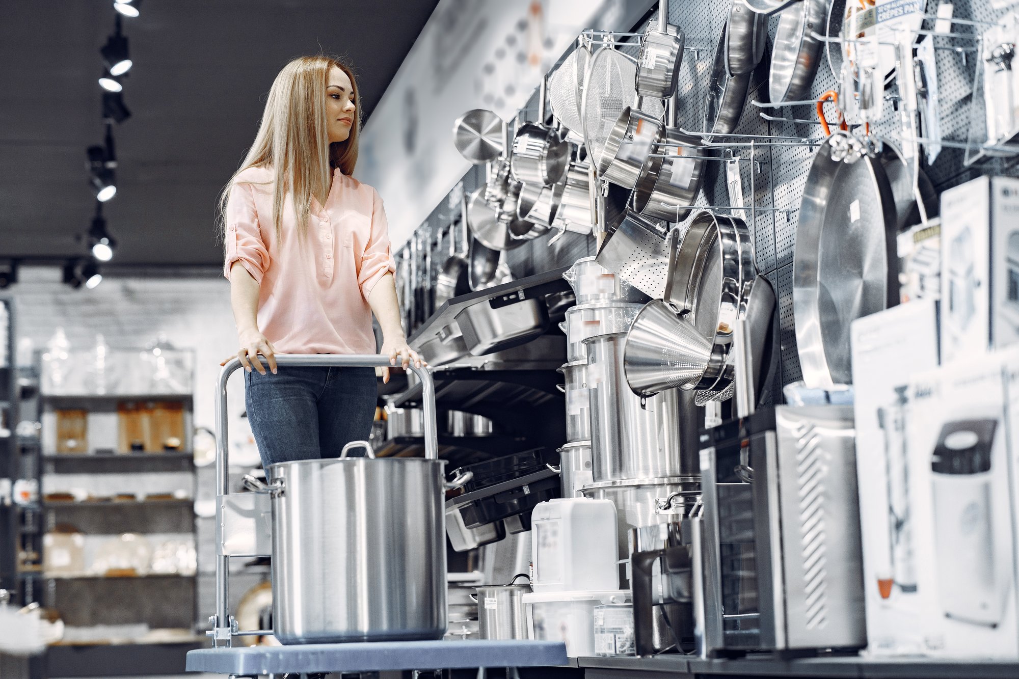 woman-pink-blouse-buys-dishes-store